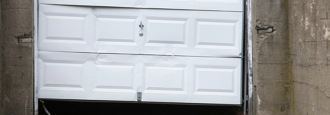 Garage Door Got Hit By A Car Dent Removal in Greenacres, FL